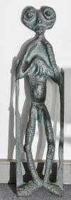 Lucas SITHOLE LS6732 "The Innkeeper", 1967 - wall sculpture in wood, partly burnt, copper oxide applied - 126.5x33.5x?? cm